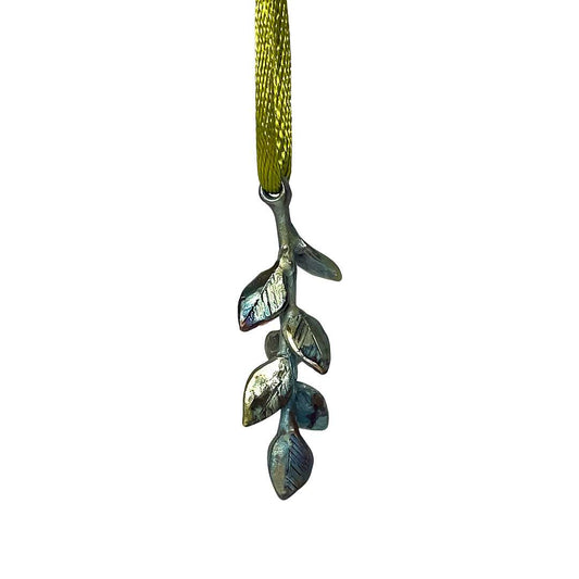 A close up for the HerbertandWilks 2024  Christmas Ornament - a bronze twig bursting with leaves with irridescent colours 